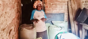 A farmer poses near her harvest
