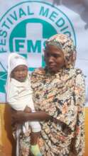 Mother with her baby awaiting cleft treatment
