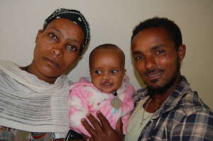 Fekadu with his parents