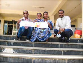 Programme Officer Nigatu, with Tamirat and parents
