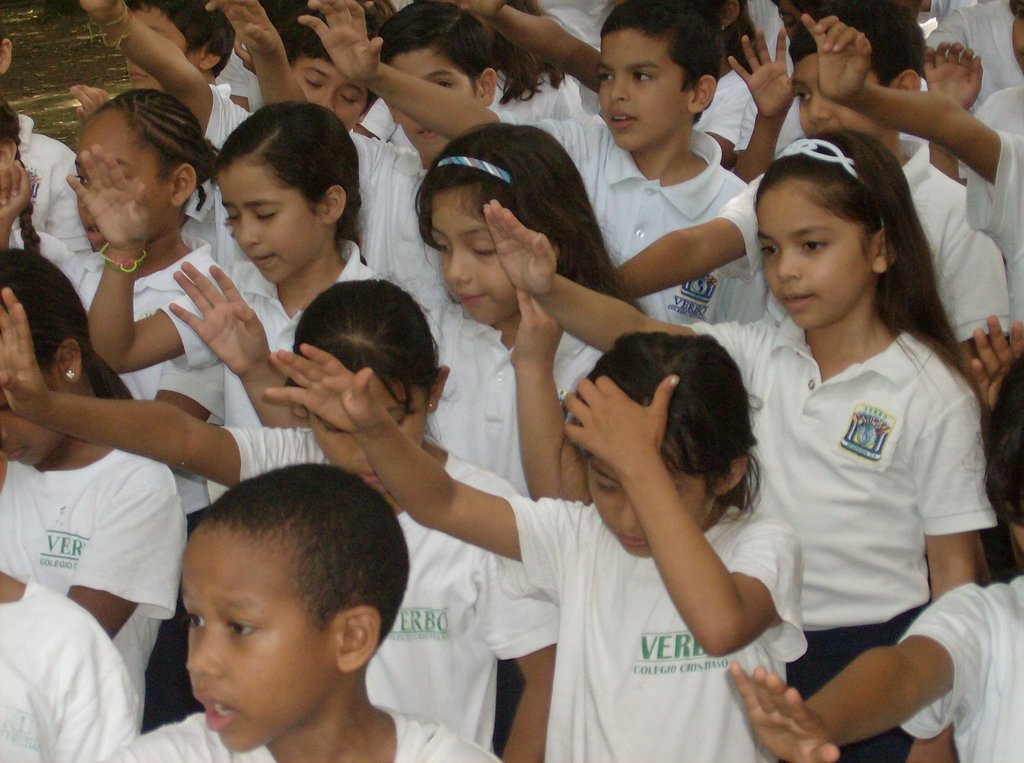 Kids praying before the ribbon-cutting!