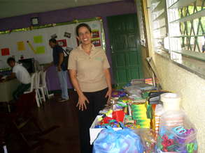 Directora Nolvia Morales with donated supplies