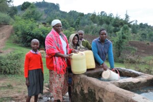 Ngariet fetching water before spring protection