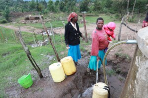 Ngariet women fetching water from protected source