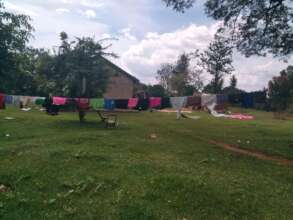 Orphaned Children clothes, line- sun drying-matron