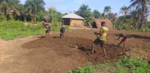 Residents preparing the land for the market garden