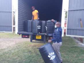 Taking delivery of water containers for schools