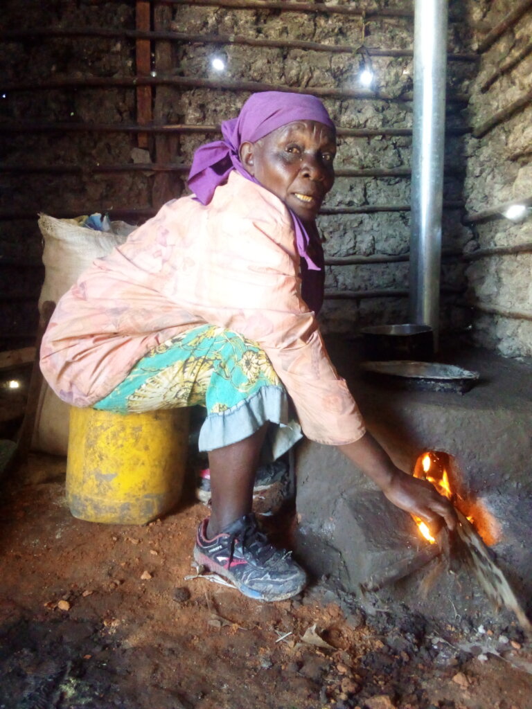 Catherine using her smokeless stove