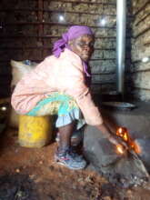 Catherine using her smokeless stove