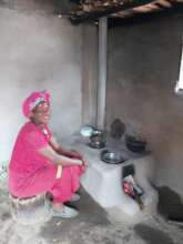 Stove installer at a stove she has built