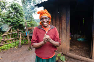 Jacinta smiling outside her kitchen