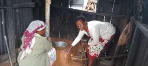 Nancy installing a smokeless stove