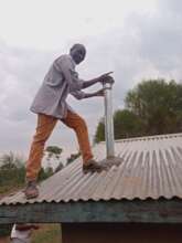 Adding the chimney through the iron sheets roof