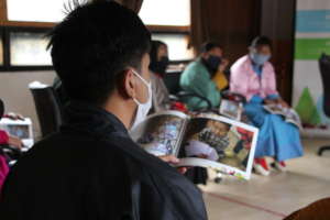 Participant looking through the Photobook