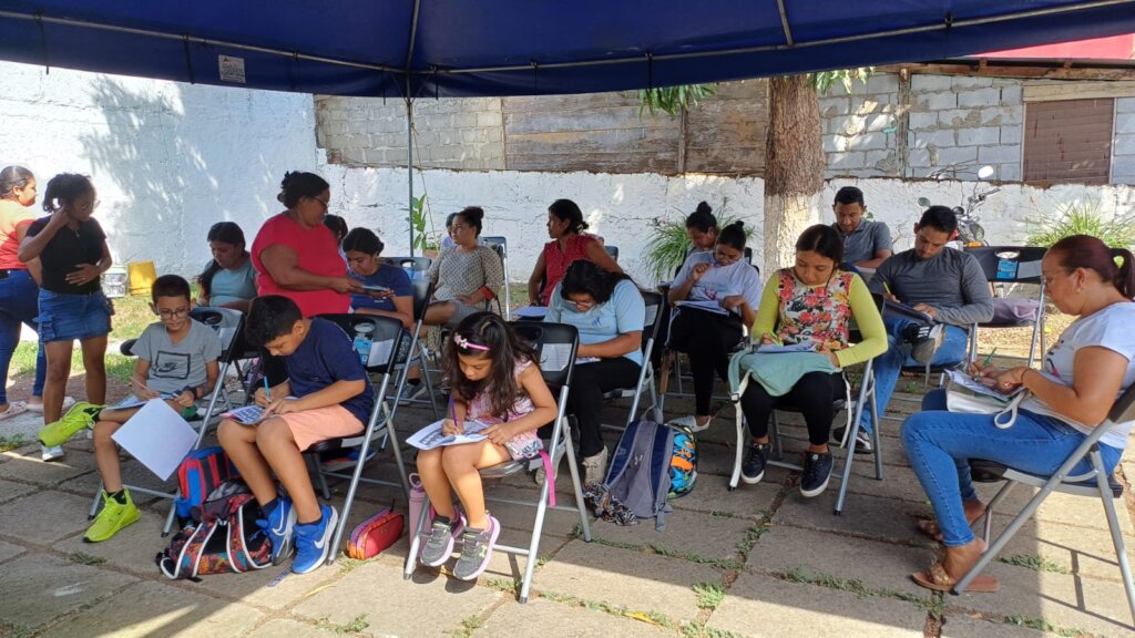 Class includes teachers, a doctor, and children