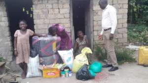Peaces family receiving items donated by you