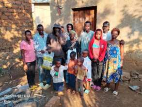 A family with a bag of grains