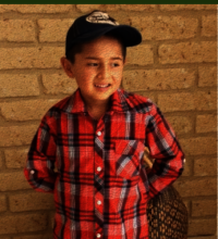 A kid waiting his equipment to access virtual educ