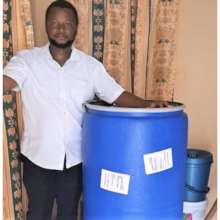 Ibrajim with barrel of supplies