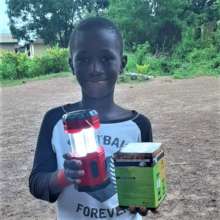 Makeni boy with solar lamp