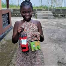 Makeni girl with solar lamp