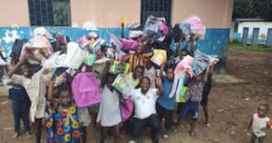 Makeni kids getting backpacks and school supplies