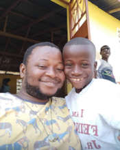 Ibrahim with a Makeni School Child