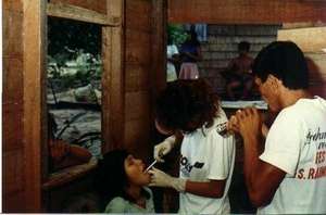 Doctor examining children
