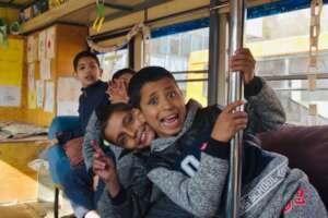 Children celebrating the reopening of libraries