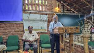 A P Thomas addressing the audience