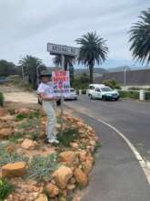 Putting up our great new posters to slow traffic.