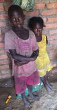 Bisi and sister at home - see Bisi's story