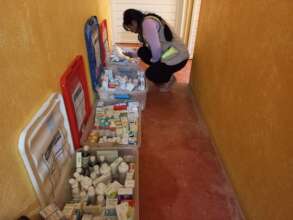 Nurse searching for the right medicine
