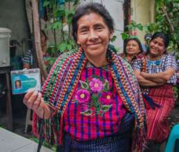 Dolores receiving her health card in Cojolya