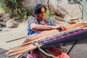 Catarina showing off her weaving skills