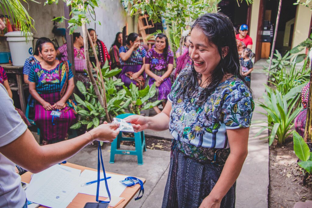 Artisan receiving her health card for 2026