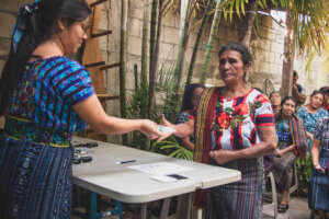 Magdalena receiving her health card