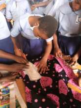 Teaching girls how to make reusable sanitary pad