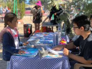 Aventurero sharing aboutheir booth at the Eco-Fair