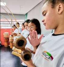 playing capoeira instruments