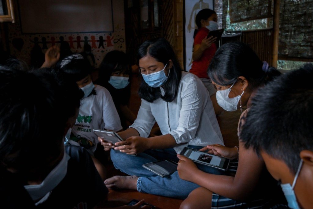 Students making recipe book using tablets