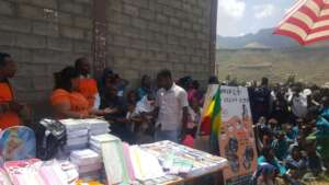 MHO  alongside poor children in rural shool