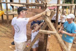 Families of volunteers building the playground