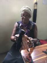 Rosemary making a doll