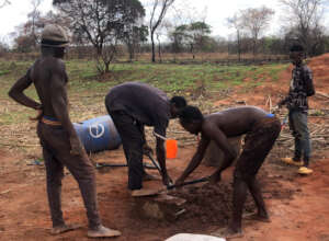 Making cement blocks to support the water tank