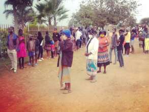 Caregivers in line for food hampers.