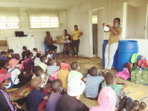 Staff demonstrates how the solar lights operate