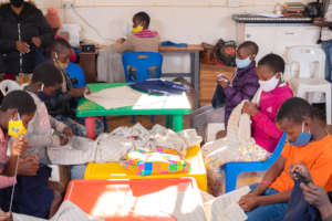 Sewing masks w/ Ms. Ncube (before current closure)