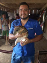Our dentist, Dr. Roy, with a pet paca