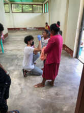 Medical student, Ramon, explaining toothbrush use